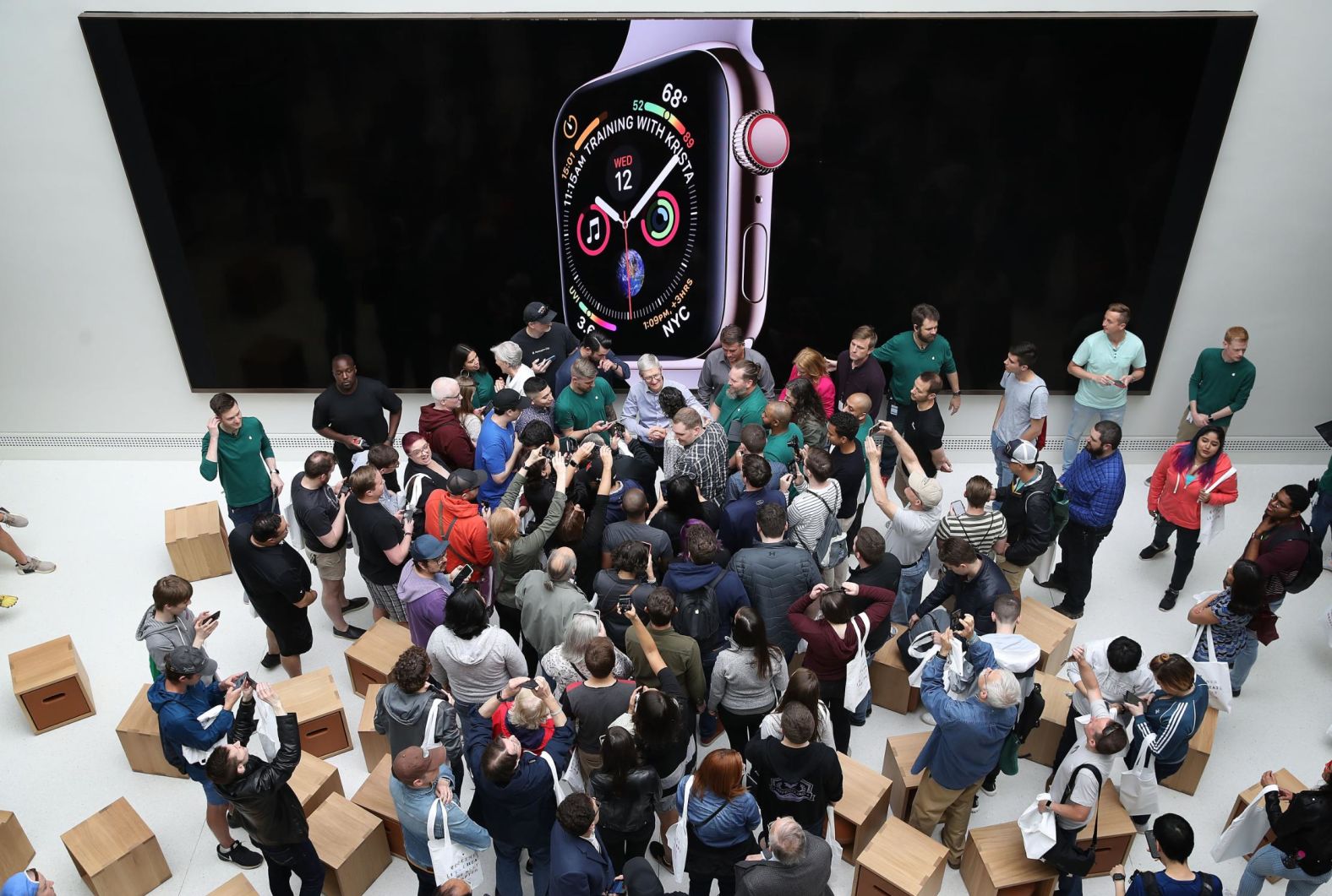 Cook welcomes customers to the opening of a new Apple Store at the historic Carnegie Library building in Washington, DC, in May 2019. The location represented Apple's most extensive restoration project to date, renovating what was once the city's Central Public Library.