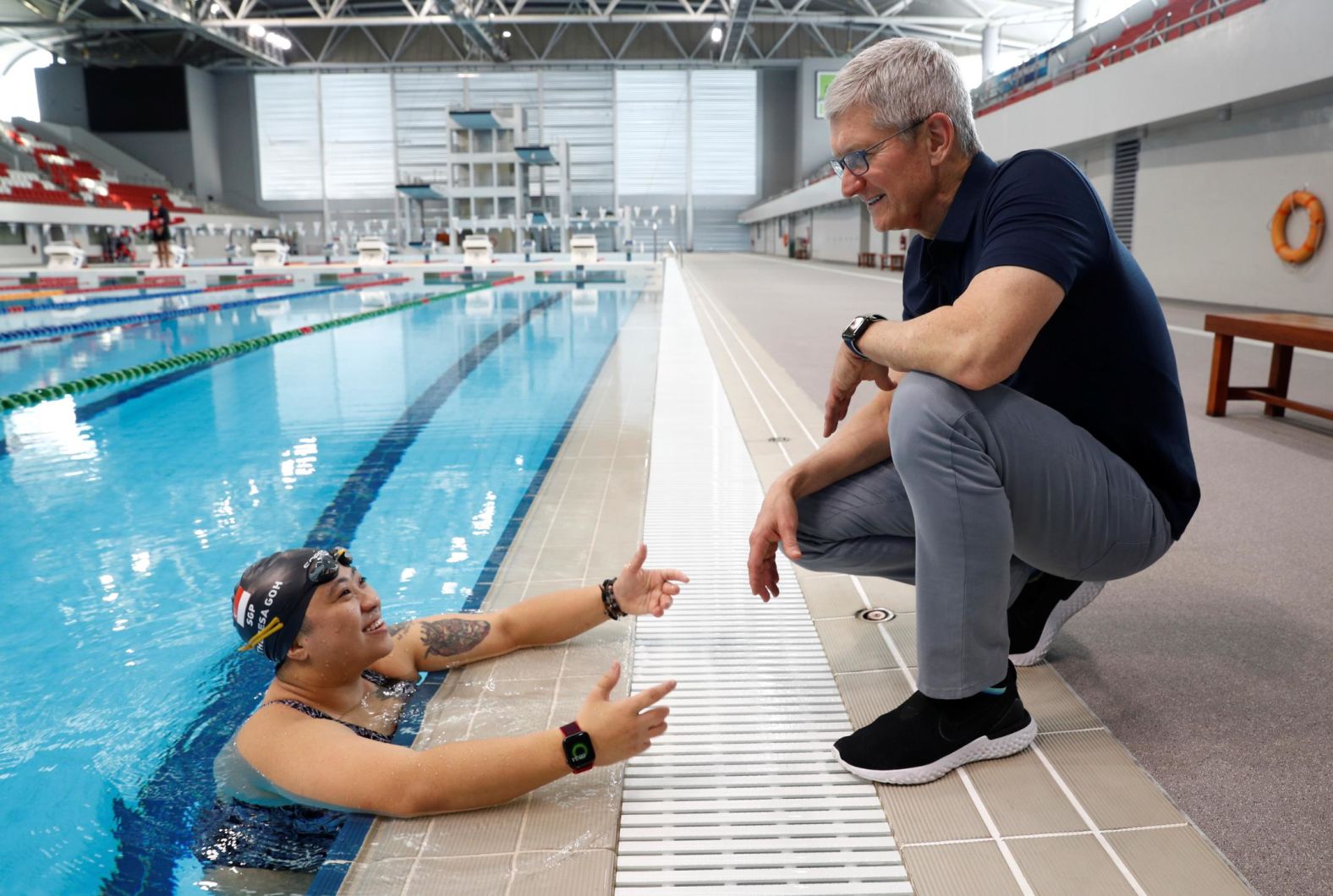 Cook speaks with Singapore Paralympian Theresa Goh about the Apple watch she uses for training in December 2019. 