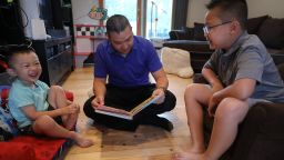 Dr Minh Tu Do Reads A Book To His Sons Joey 4 Do And Justin 9 At Home Both Children Received The Covid Vaccine As Part Of A Pfizer Biontech Clinical Trial With Rutgers University