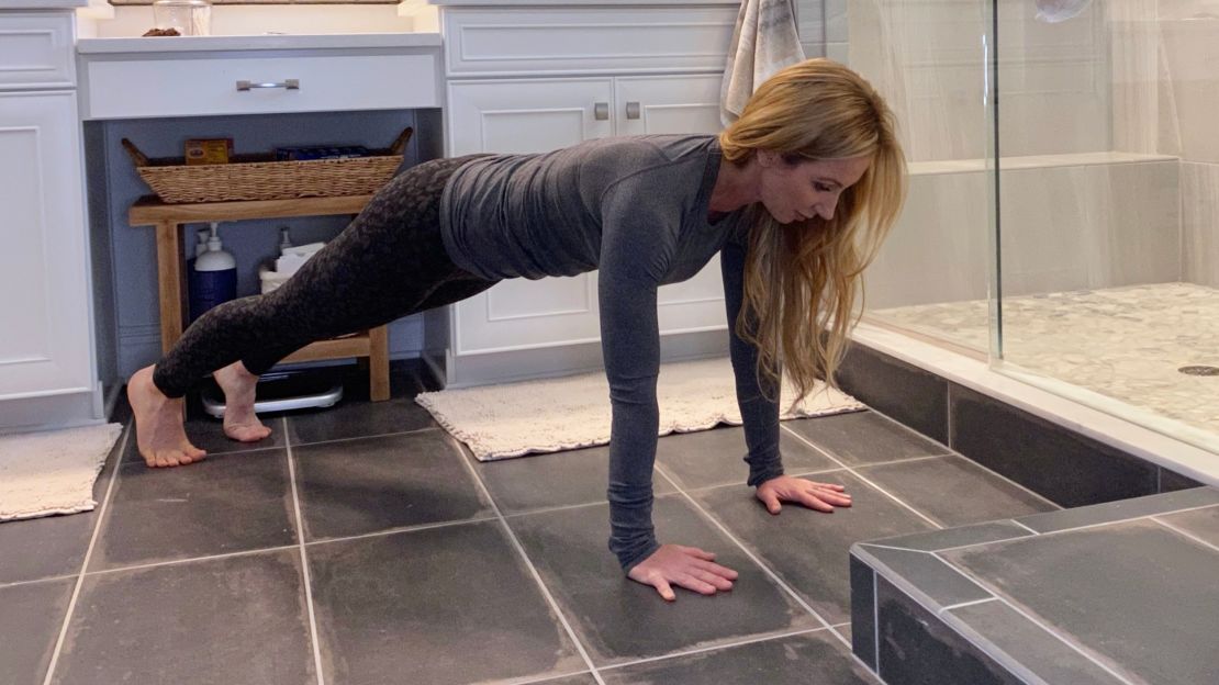 Santas does push-ups in the bathroom before showering as part of her morning routine.