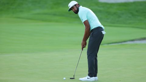 Finau putts on the first-playoff 18th hole at the Northern Trust.