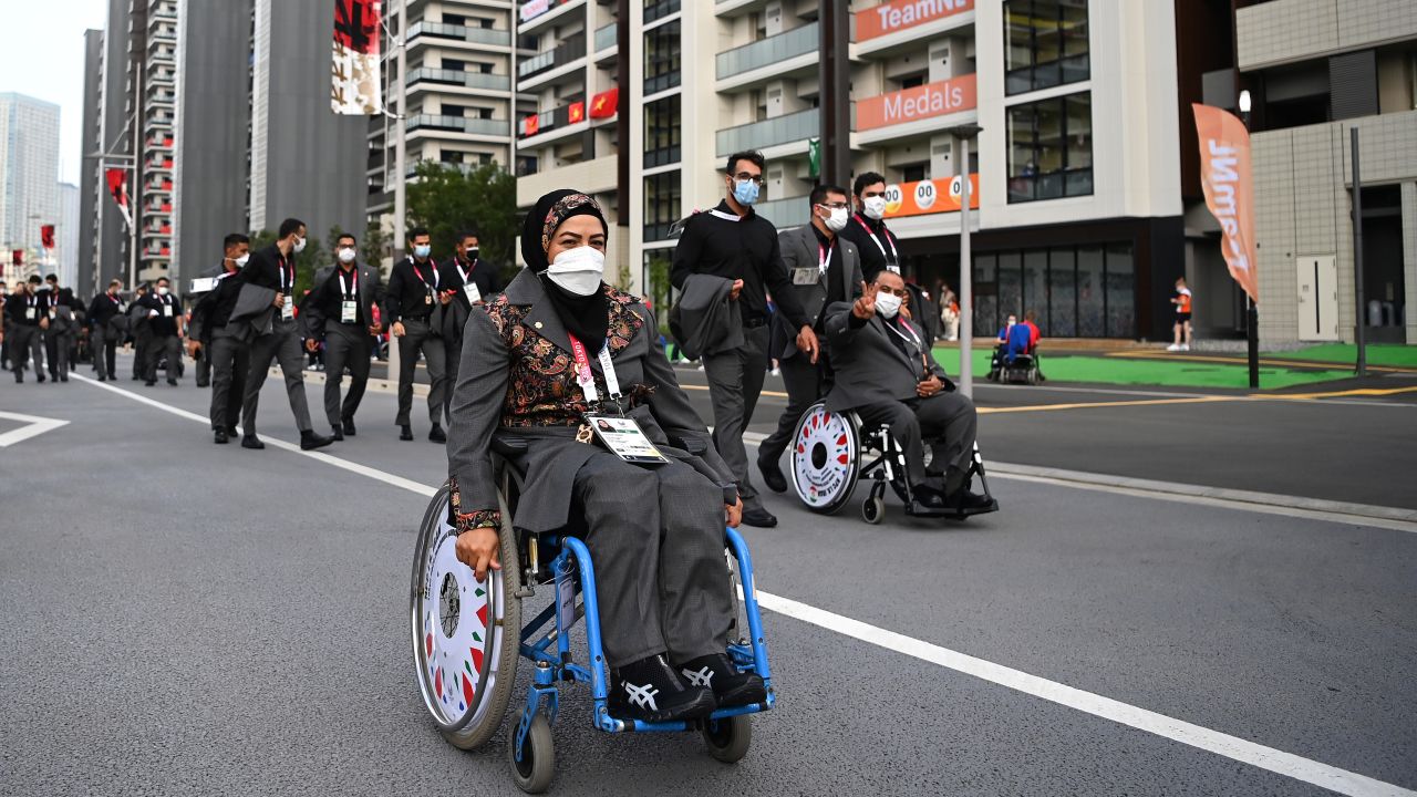 Members of Team Iran make their way to the Opening Ceremony of the Tokyo 2020 Paralympic Games.