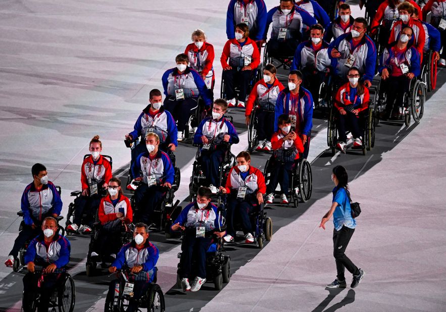 Russian athletes take part in the traditional parade during the opening ceremony. Russian athletes at these Paralympics are officially recognized as members of the Russian Paralympic Committee. That's because in 2019, the World Anti-Doping Agency banned Russia from all international sporting competitions, including the Olympics, for doping non-compliance. Russian athletes can't compete under their country's name, flag and national anthem until December 2022.