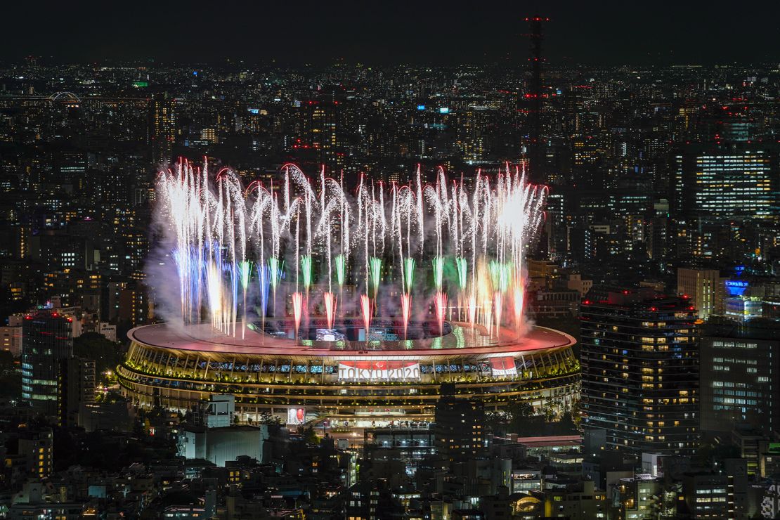 Fireworks illuminate the skies of Tokyo over the National Stadium during the Opening Ceremony.