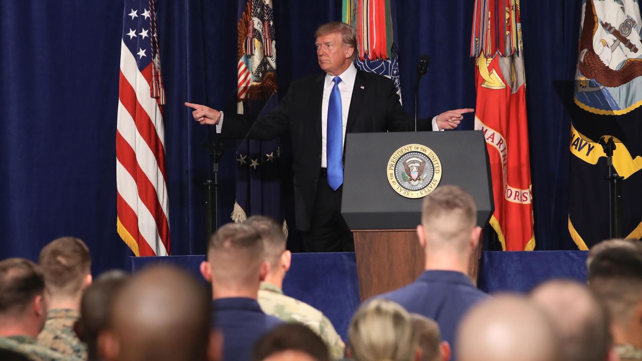 Then-President Donald Trump gestures before delivering remarks on Americas military involvement in Afghanistan at the Fort Myer military base on August 21, 2017 in Arlington, Virginia. 