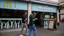 BRISTOL, UNITED KINGDOM - 2021/08/16: Men walk past a branch of McDonald's in Bristol. (Photo by Dinendra Haria/SOPA Images/LightRocket via Getty Images)