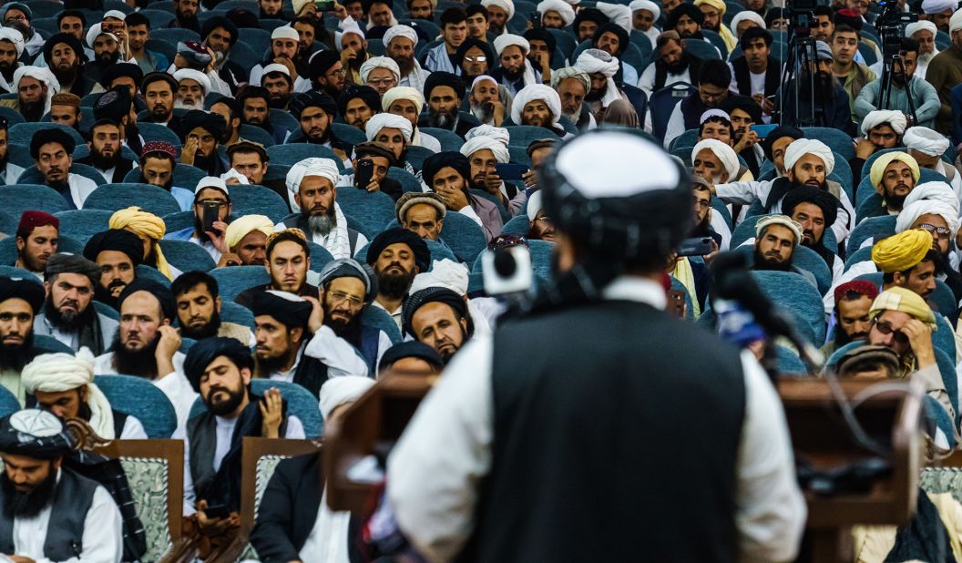 Zabihullah Mujahid, a spokesman for the Taliban, addresses hundreds of religious leaders who were attending an event held by the Taliban's Preaching and Guidance Commission on August 23.