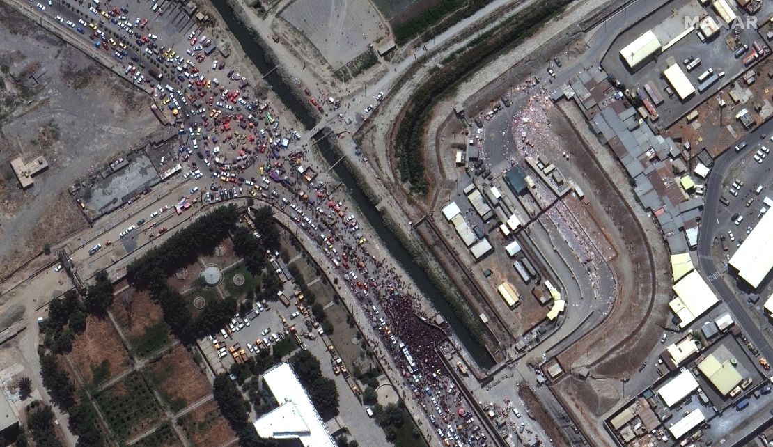 A satellite image shows crowds at a gate to Kabul's airport on August 23 in Afghanistan.