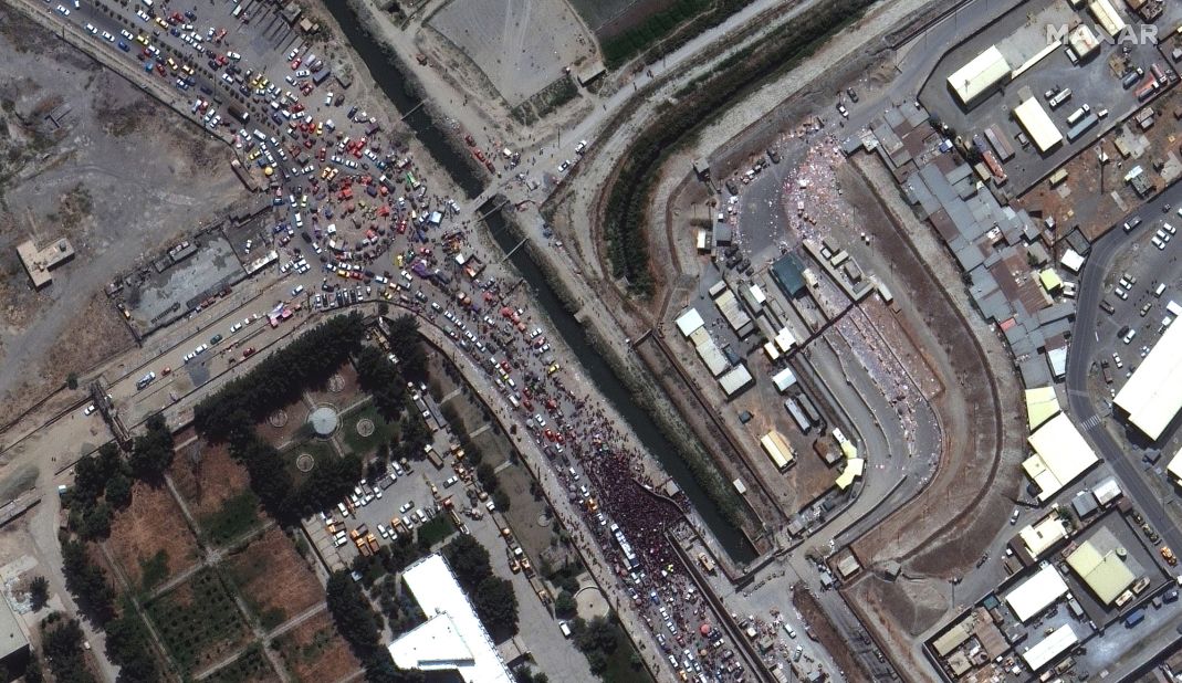 This satellite image shows crowds gathered outside a gate to the international airport in Kabul on August 23. Western countries were in <a href="https://www.cnn.com/2021/08/23/asia/kabul-airport-afghanistan-intl-hnk/index.html" target="_blank">a frantic race</a> to complete what US President Joe Biden called "one of the largest, most difficult airlifts in history."