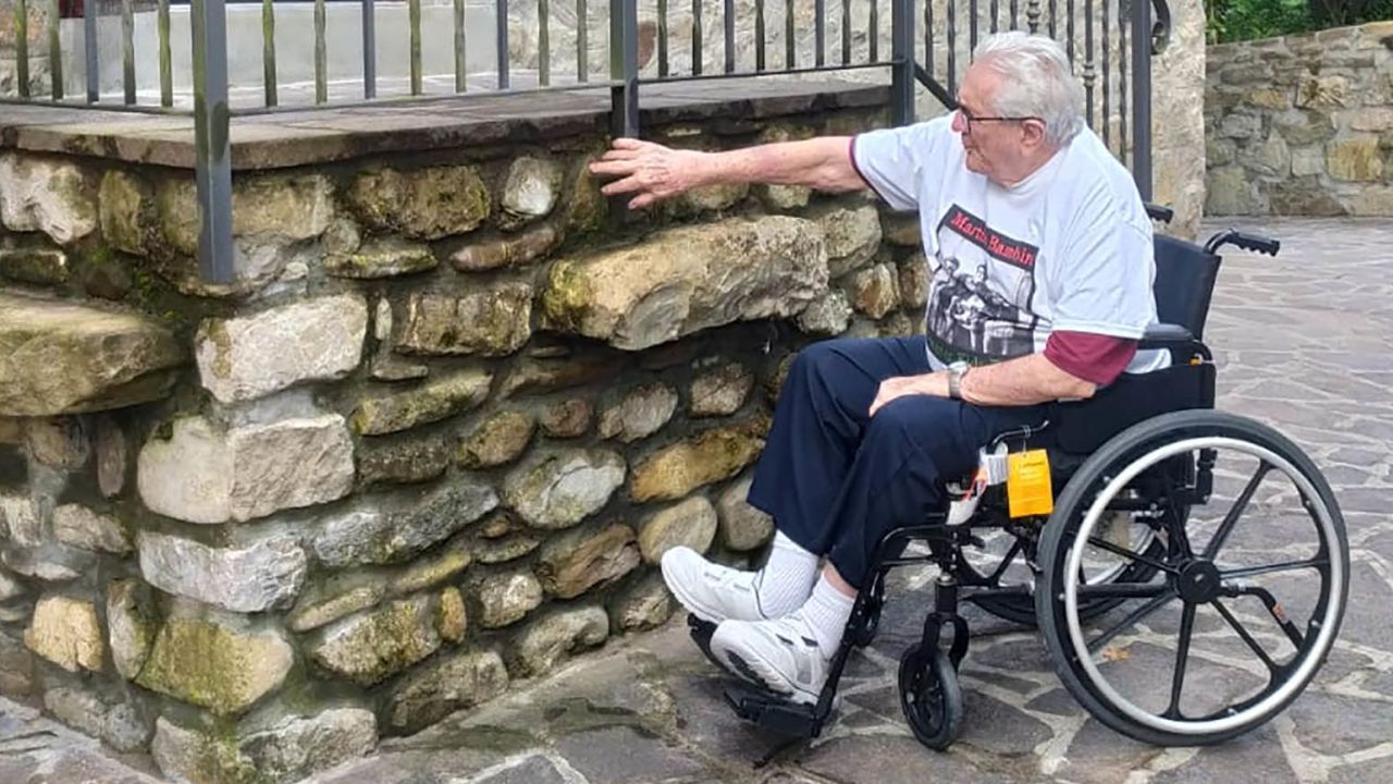 Adler pictured outside the house in the village of Monterenzio where he found the siblings.