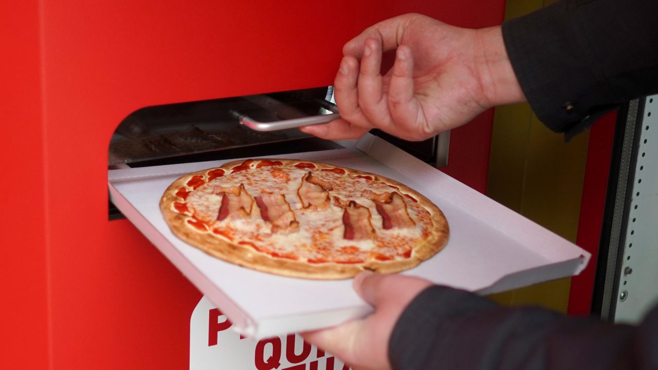 <strong>Top slot: </strong>The pizza (seen here, pancetta) comes out of a real vending machine slot.