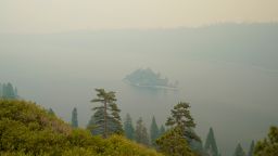 Lake Tahoe's Emerald Bay is shrouded in smoke from the Caldor Fire, near South Lake Tahoe, California, on Tuesday, August. 24, 2021. 