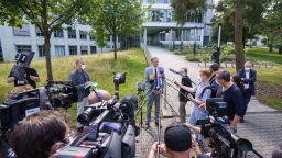 24 August 2021, Hessen, Darmstadt: Chief Public Prosecutor Robert Hartmann (M) speaks to media representatives in front of building L201 on the Lichtwiese campus of the TU Darmstadt. The day before, six people had been brought to clinics here with symptoms of poisoning, a 30-year-old student was in critical condition. Attempted murder is now being investigated because of the suspected poison attack. Photo: Frank Rumpenhorst/dpa (Photo by Frank Rumpenhorst/picture alliance via Getty Images)