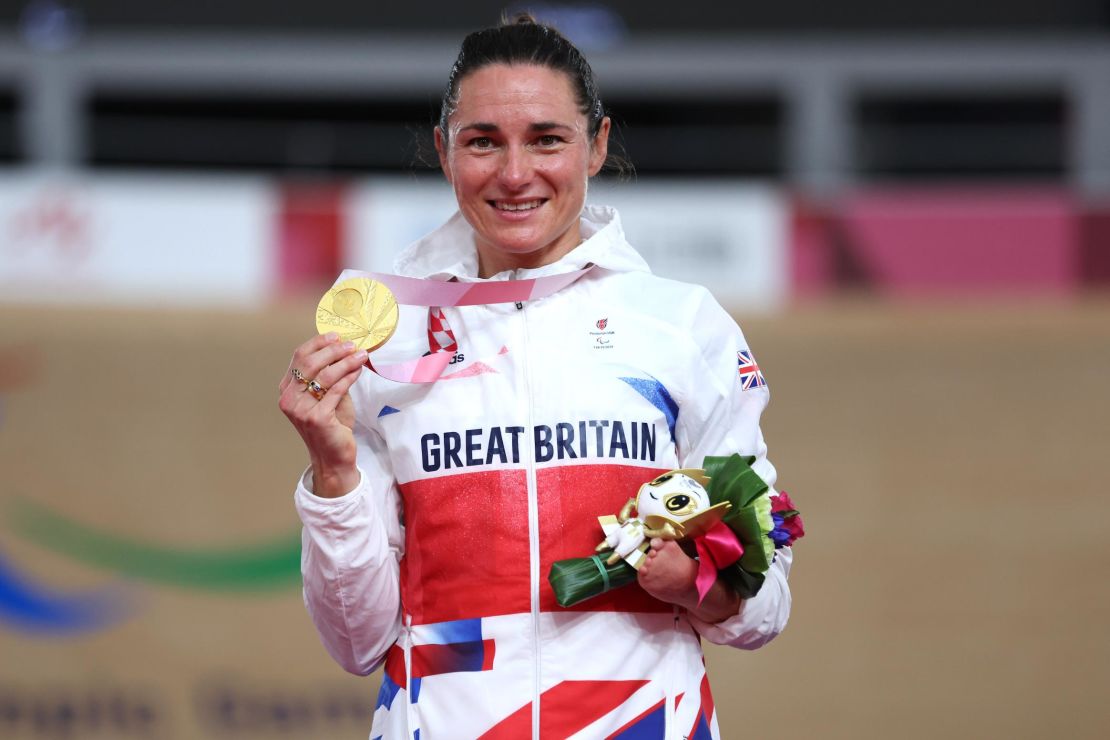 Sarah Storey poses with her gold medal at Tokyo 2020. 