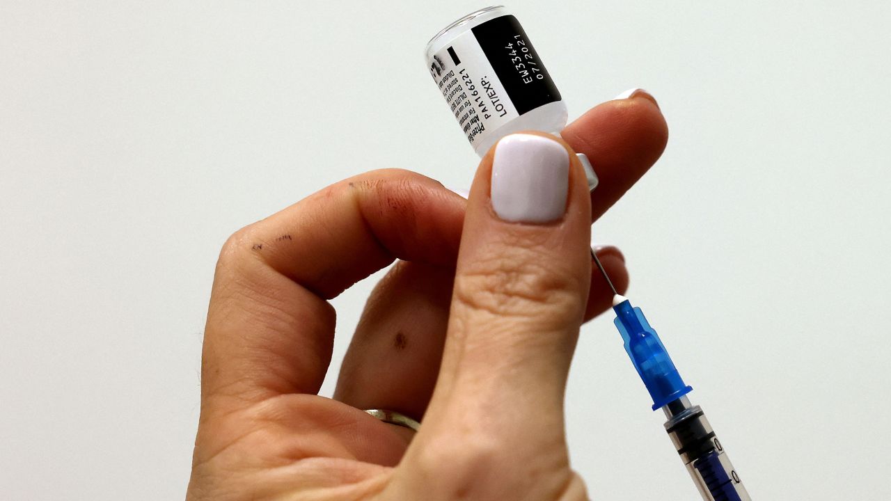 An Israeli nurse prepares to inject a third dose of the Pfizer/BioNTech Covid-19 vaccine in Tel Aviv on July 30, 2021, as Israel launches its campaign to give booster shots to people aged over 60. (Photo by Emmanuel DUNAND / AFP) (Photo by EMMANUEL DUNAND/AFP via Getty Images)