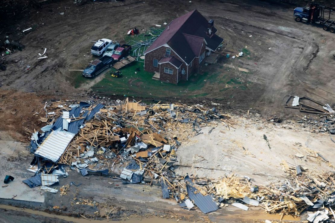 Damaged homes and cars seen in Waverly, Tennessee.