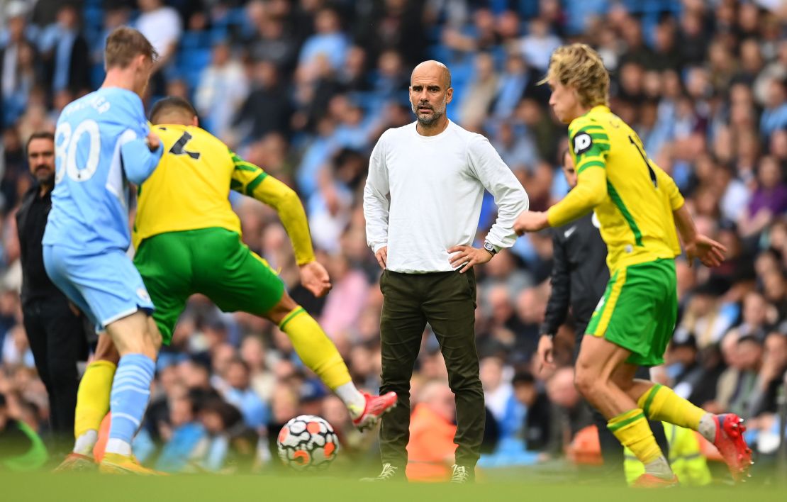 Guardiola looks on during the Premier League match between Manchester City and Norwich City.