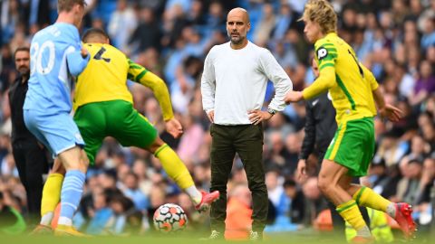 Guardiola looks on during the Premier League match between Manchester City and Norwich City.