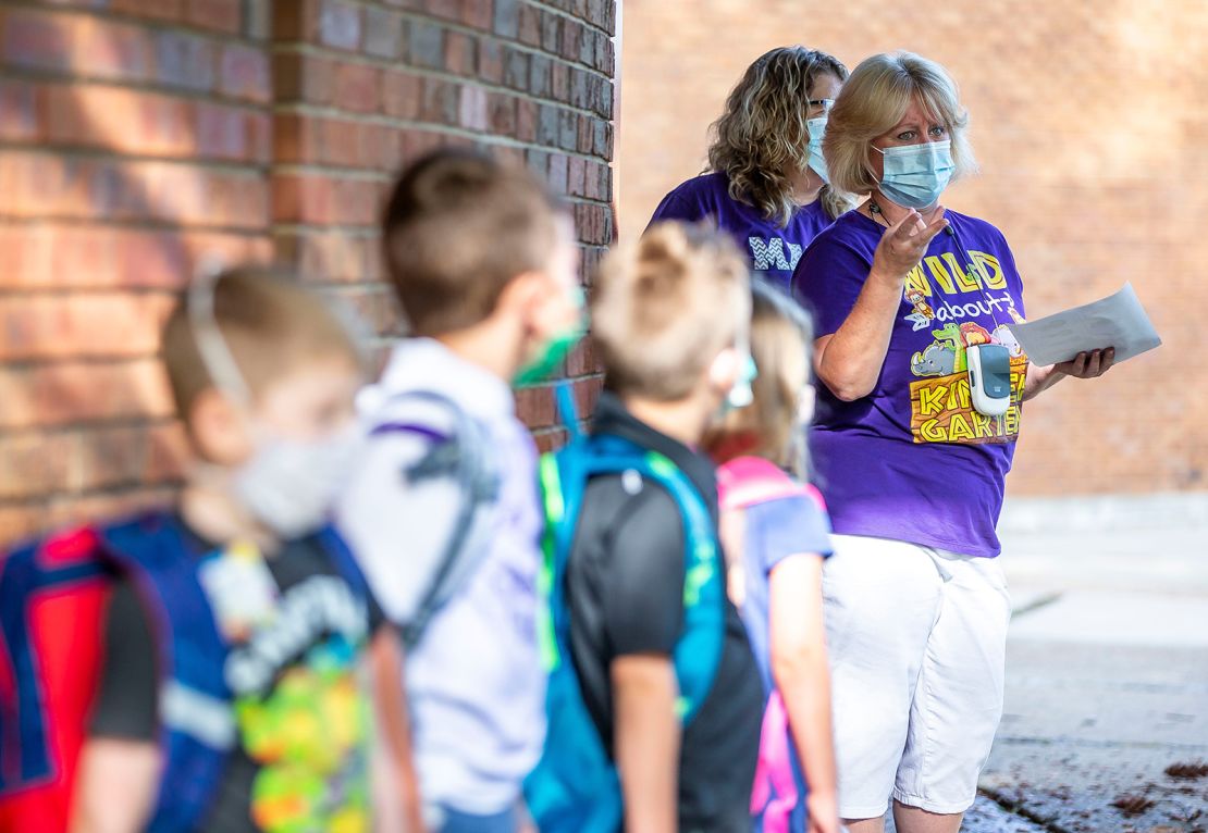 Kindergarten teacher Shelly Kelly talks with her students as they line up on the first day of school for District 186 at Owen Marsh Elementary School in Springfield, Illinois, on Monday, August 23.