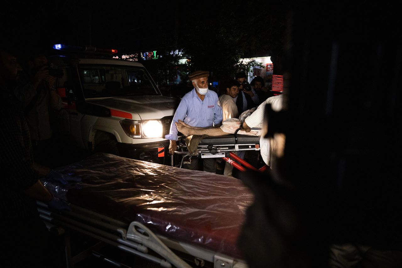 An injured person arrives on a stretcher at a Kabul hospital on Thursday.