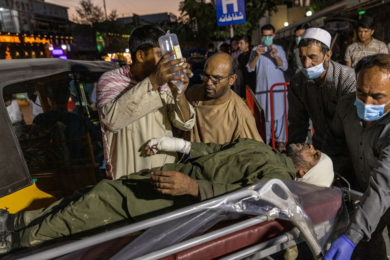 A man receives medical attention outside a Kabul hospital on Thursday.