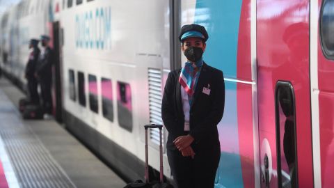 A stewardess waits before boarding a SNCF's low-cost Ouigo TGV train at the Madrid Puerta de Atocha train station in Madrid on May 7, 2021 after the pre-launch presentation for the Madrid-Barcelona route. (Photo by PIERRE-PHILIPPE MARCOU / AFP) (Photo by PIERRE-PHILIPPE MARCOU/AFP via Getty Images)
