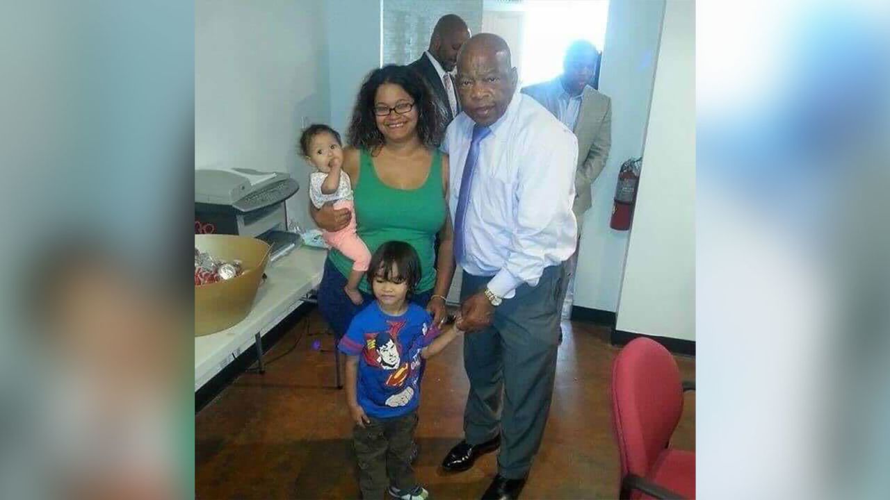 Alejandro Chavez's wife, Natacha, and children, Alejandro and Amelia, meet John Lewis in 2014. 