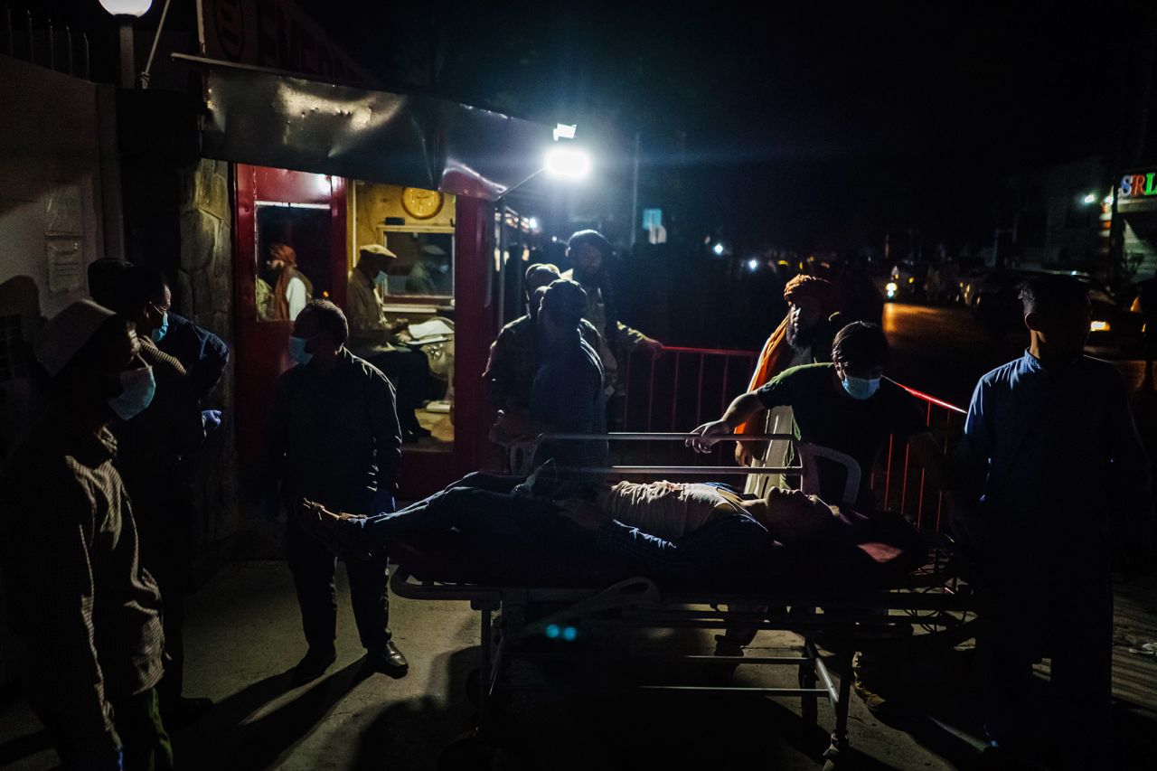 A person is wheeled on a stretcher outside a hospital on Thursday.