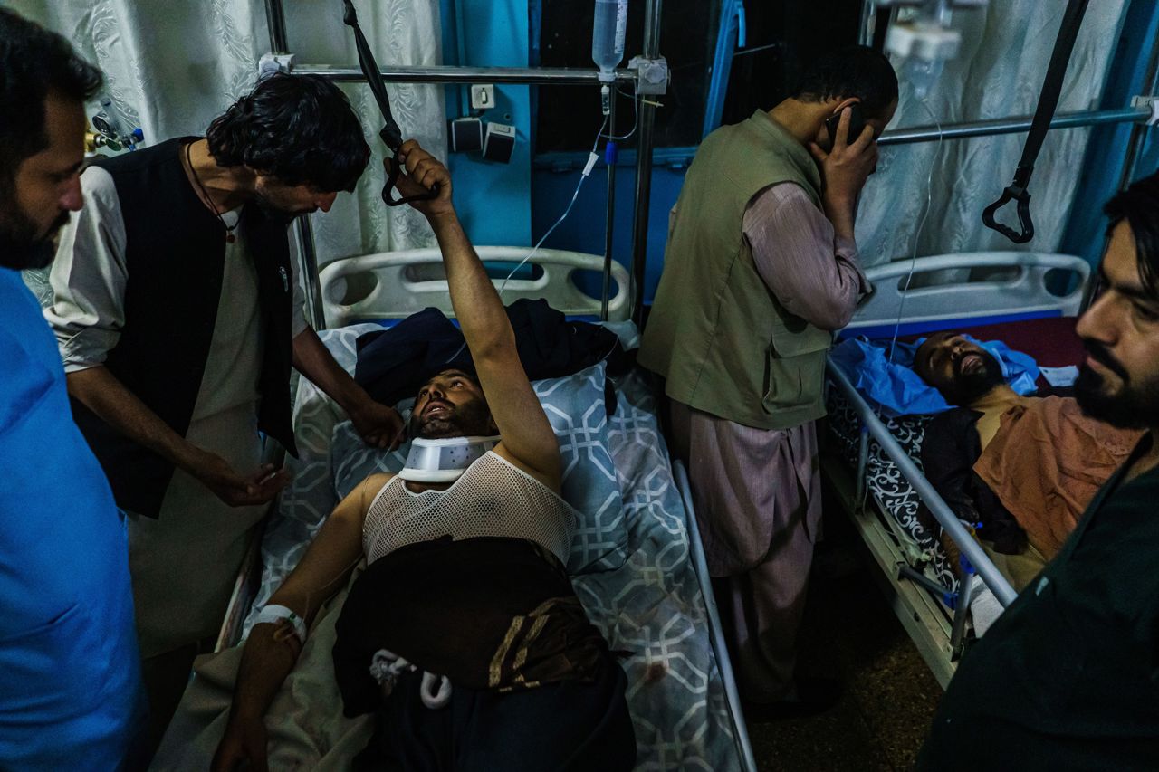 People who were injured in Thursday's attack are visited by family members at a hospital in Kabul.