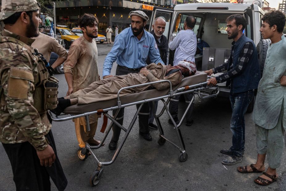 An injured person arrives at a hospital after the suicide bombing outside the airport in Kabul on August 26.