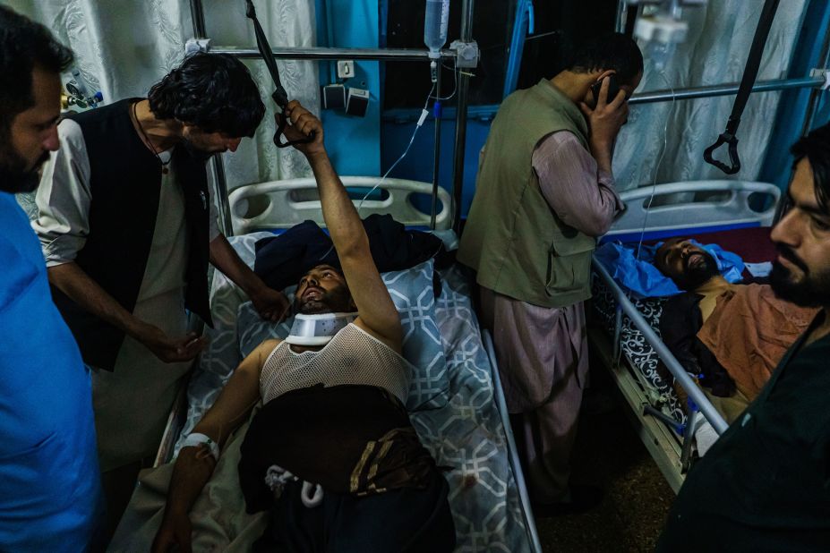 People who were injured in the August 26 suicide bombing are visited by family members at a hospital in Kabul.