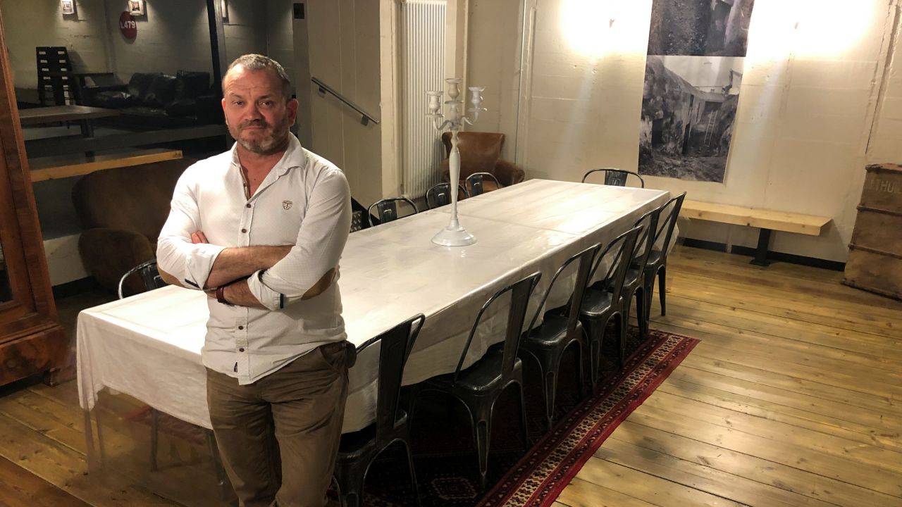 Serge Colliou poses inside a WW2-era German bunker renovated and turned into a guest house for rent on Airbnb, in Saint-Pabu, France, August 19, 2021. Picture taken August 19, 2021. REUTERS/Manuel Ausloos