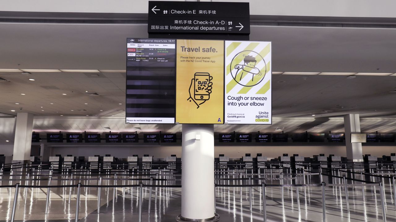 An information board in a deserted check-in hall at the Auckland Airport on July 7, 2020. 