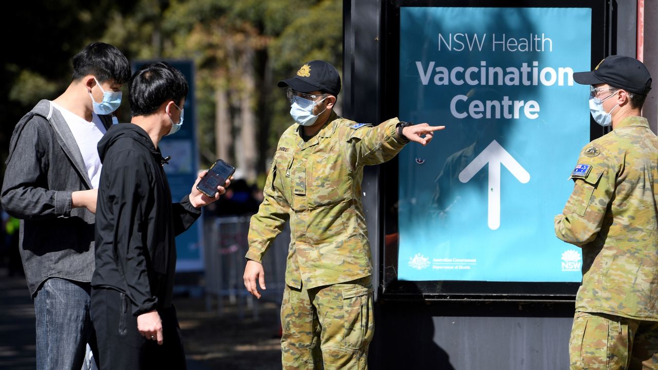 Australian Defense Force personnel assist the public at a Covid-19 vaccination clinic in Sydney on August 18, 2021.