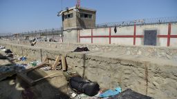 A suitcase and backpacks of Afghan people who were waiting to be evacuated are seen at the site of the August 26 twin suicide bombs, which killed scores of people including 13 US troops, at Kabul airport on August 27, 2021. (Photo by WAKIL KOHSAR / AFP) (Photo by WAKIL KOHSAR/AFP via Getty Images)