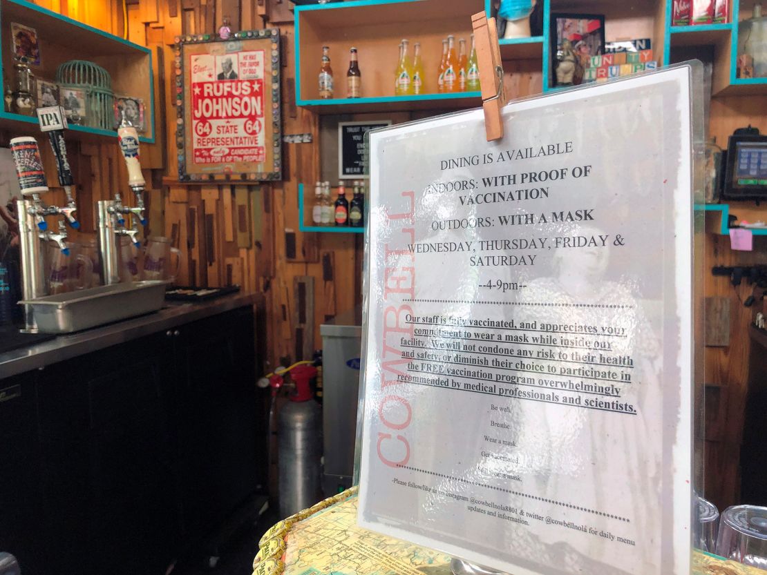 A sign at a counter in Cowbell on Friday, Aug. 6, 2021, tells customers that they can eat indoors if they have proof of vaccination against COVID-19. 