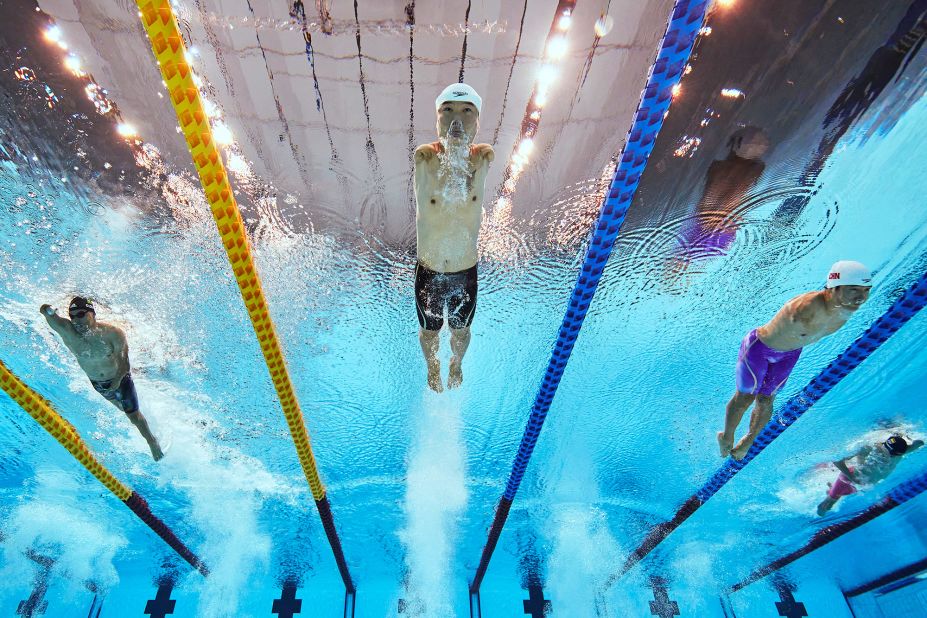 Chinese swimmer Zheng Tao, center, competes in the 100-meter freestyle on August 26.