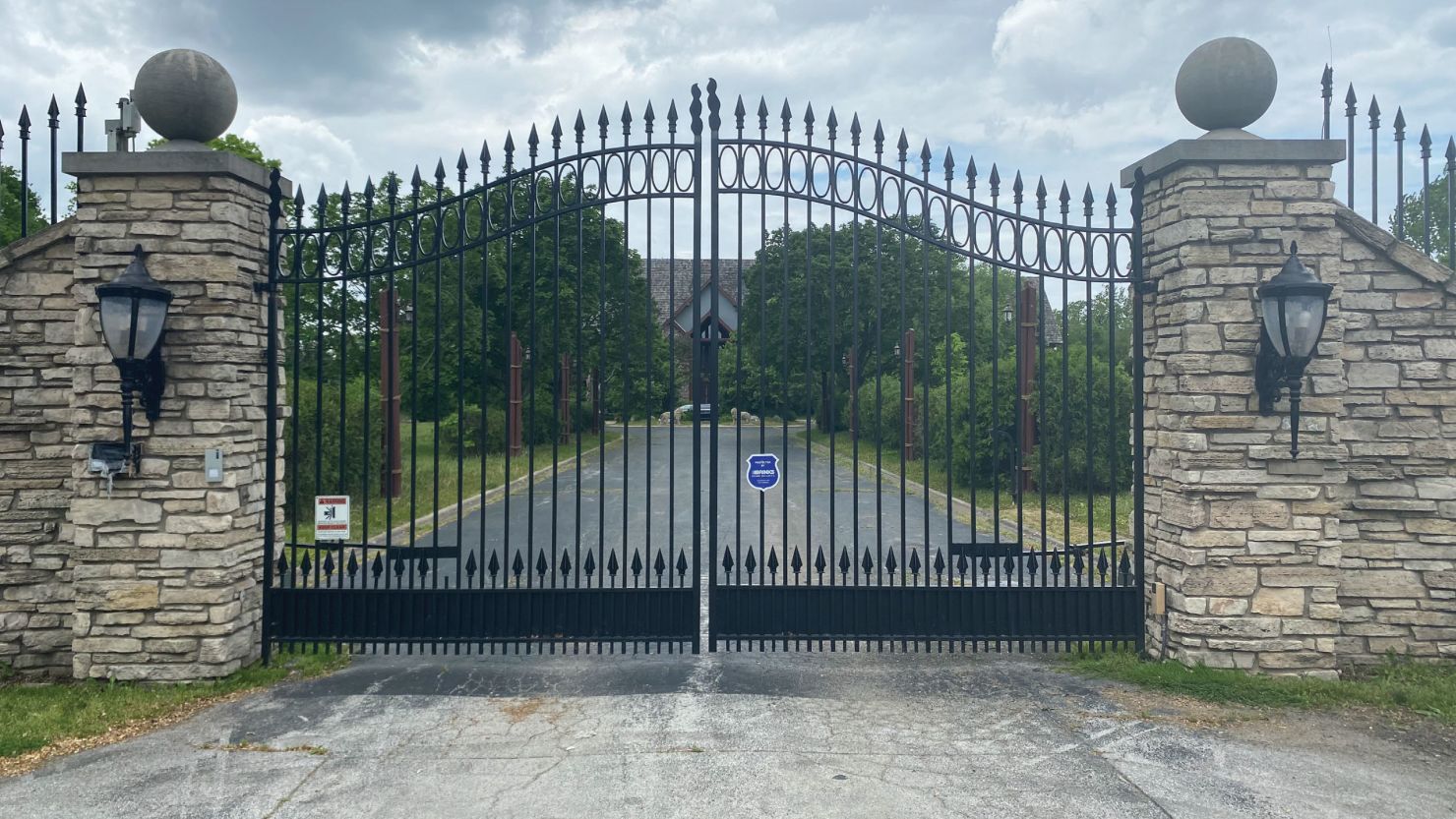 An undated photo provided by prosecutors shows the gates of R. Kelly's Olympia Fields house, which also served as the "Chocolate Factory" recording studio.
