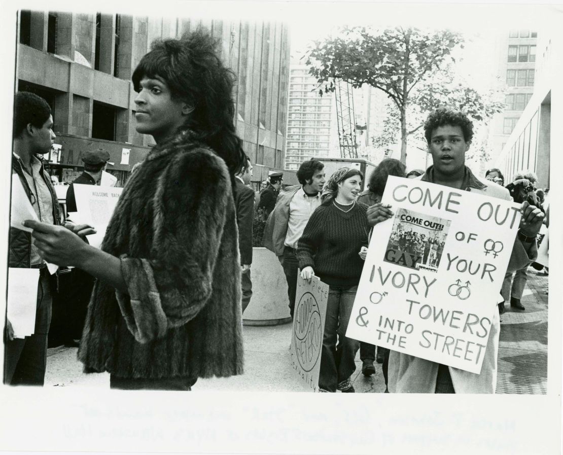 A 1970 photo of Marsha P. Johnson handing out flyers in support of Gay Students at NYU is seen here courtesy of the New York Public Library's "1969: The Year of Gay Liberation" exhibit.