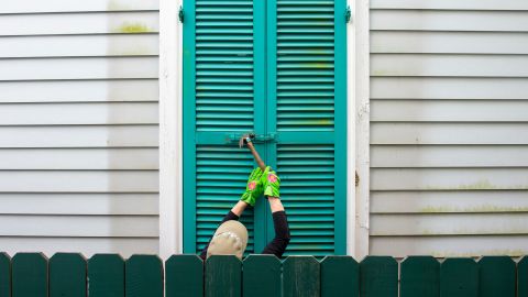 In New Orleans, storm shutters are hammered closed as the city prepares for Ida.