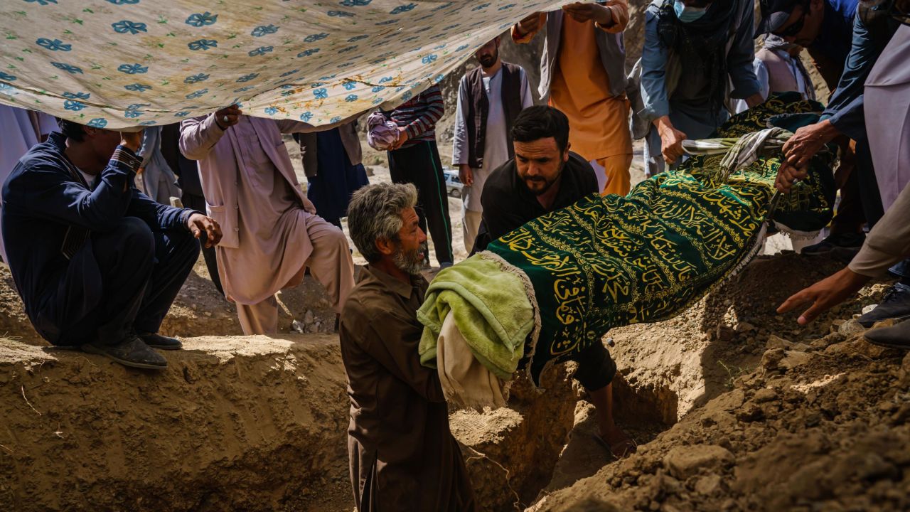 Relatives of a man who was killed in the Kabul airport bomb carry his body during his funeral on Martyrs Hill on the outskirts of the Afghan capital on Friday.