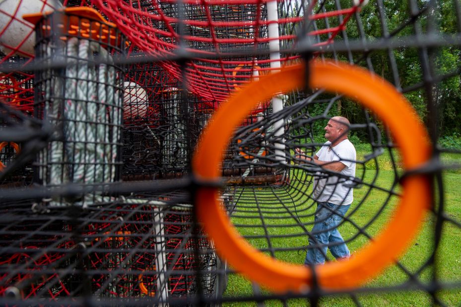 John Guenther unloads about 400 crab traps that he had to pull out of the water near his home in the eastern St. Bernard Parish on August 27.