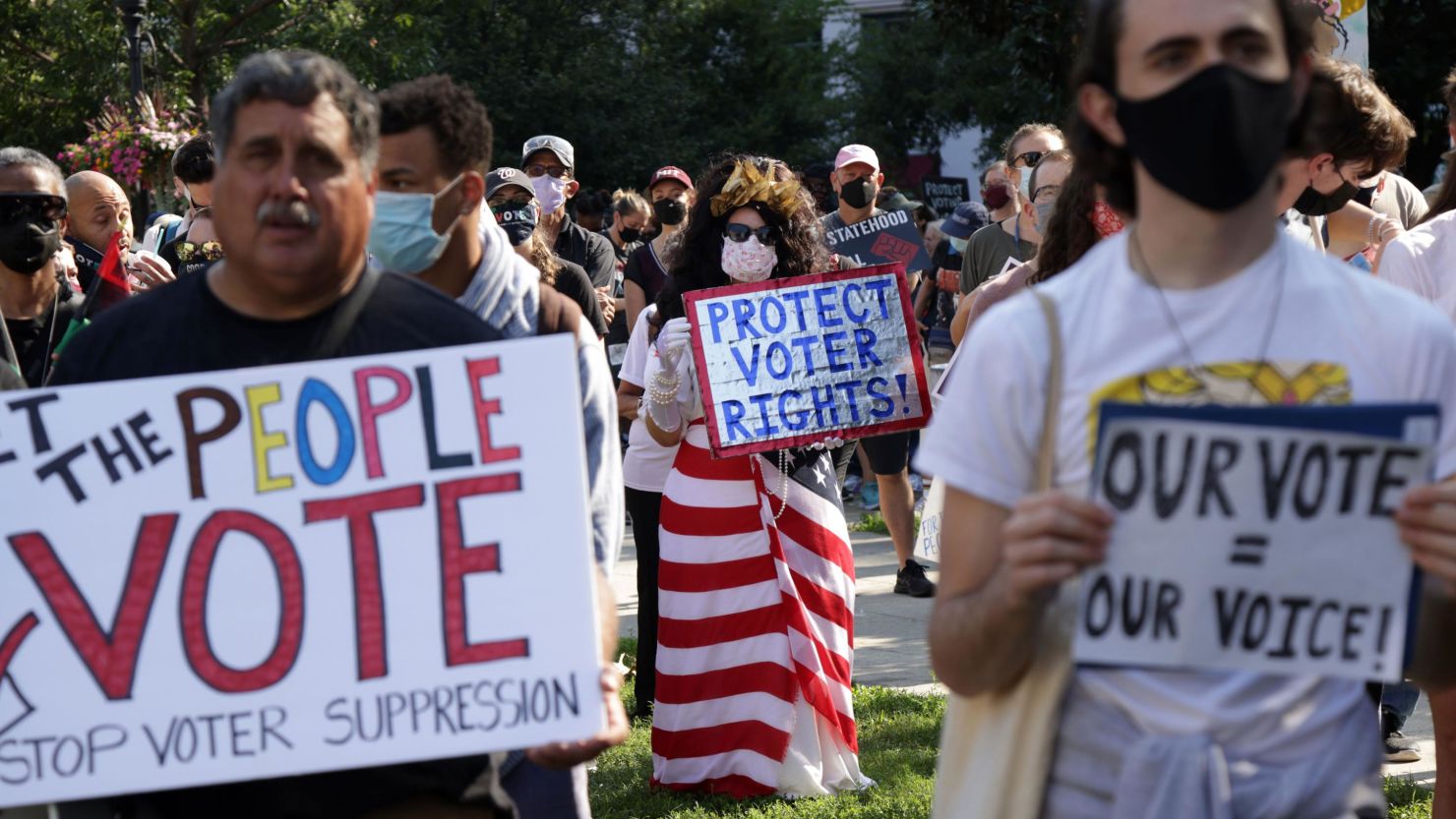 Voting rights activists participate in a pre-march rally during a March On For Voting Rights event at McPherson Square on August 28, 2021, in Washington, DC. 