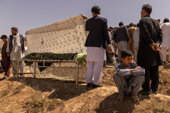 Ruhullah, 16, mourns during <a href="index.php?page=&url=https%3A%2F%2Fwww.nytimes.com%2F2021%2F08%2F27%2Fworld%2Fasia%2Fafghanistan-airport-bombing-family.html" target="_blank" target="_blank">the burial of his father,</a> Hussein, a former police officer who was killed in the attack at the Kabul airport. Ruhullah survived the blast but got separated from his father and did not know he had died until he made his way back to his family a day later.