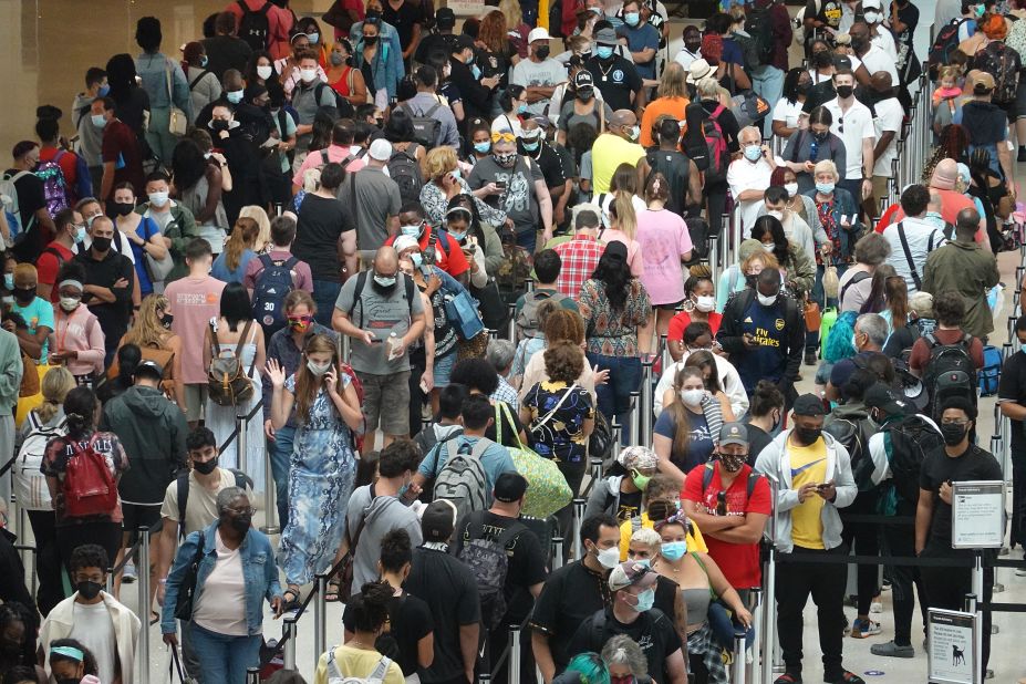 People stand in line at the Louis Armstrong New Orleans International Airport on August 28. Many residents were evacuating the area ahead of Hurricane Ida.