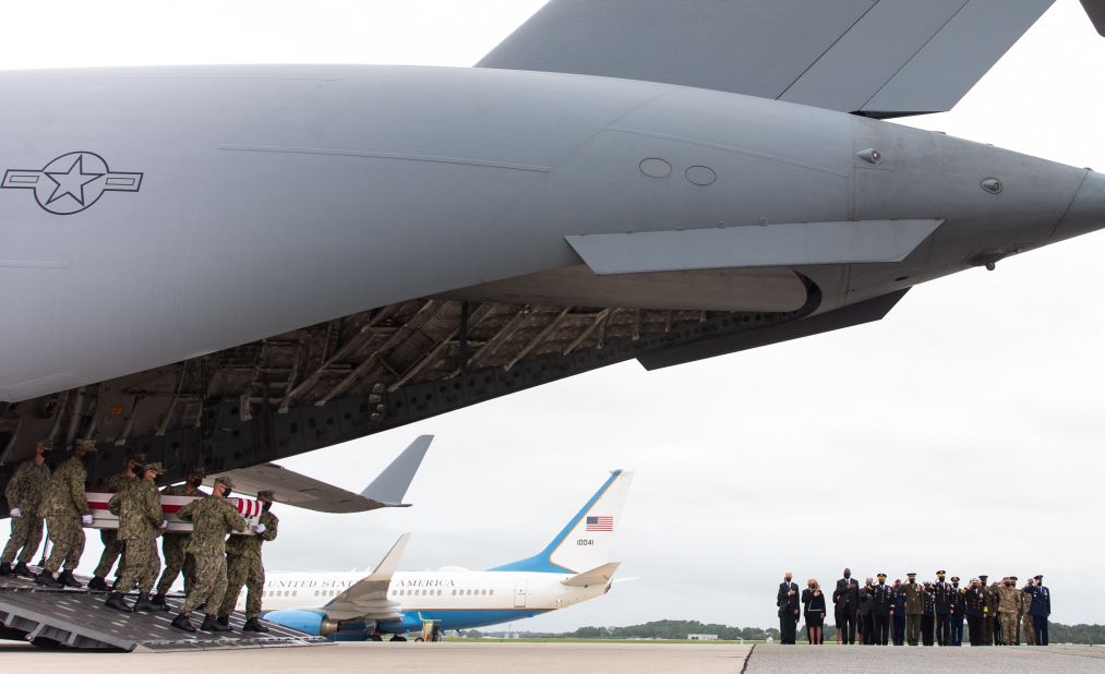 US President Joe Biden and other officials watch as flag-draped cases <a href="https://www.cnn.com/2021/08/29/politics/biden-dover-afghanistan-service-members-killed/index.html" target="_blank">carrying the remains of American service members killed in Afghanistan</a> return to the United States on August 29.