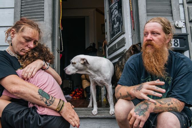 The Boudreaux family sits on their front porch as they await the arrival of Hurricane Ida.