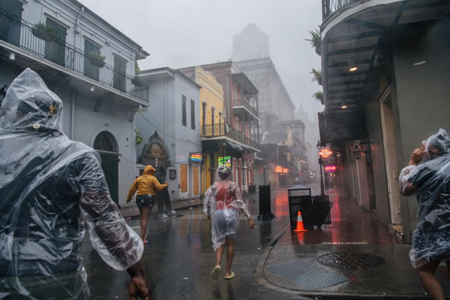 People walk through the French Quarter in New Orleans on August 29.