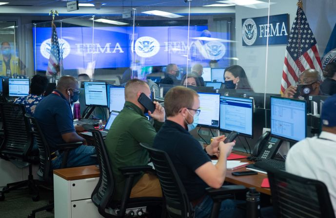 People work inside the Federal Emergency Management Agency's headquarters in Washington, DC, on August 29.