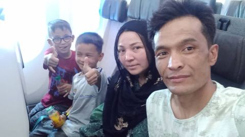 Shirzad and his family on the plane from Kabul to Bahrain on August 24.